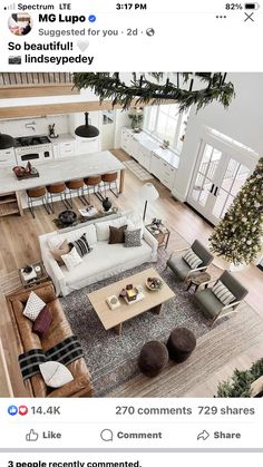 an aerial view of a living room with furniture and decor on the floor, including couches