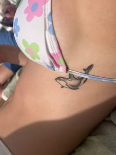 a woman with a tattoo on her stomach