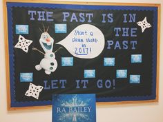 a bulletin board with a snowman saying the past is in the past