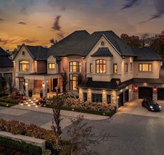 an aerial view of a luxury home at dusk