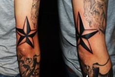 two men with tattoos on their arms and one has a star tattooed on his arm