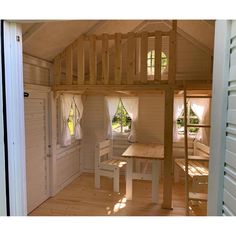 there is a loft bed in the middle of this room with stairs leading up to it