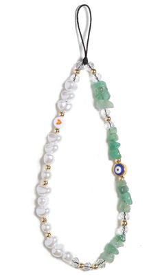 a white and green necklace with beads on the front, an evil eye in the middle