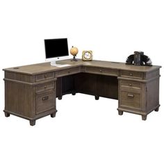 an l - shaped desk with two drawers and a computer monitor