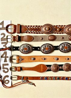 "Concho Belt Genuine Leather Southwestern Western Country Cowgirl Vintage Upcycle CHOOSE ONE  ....CHOOSE ONE (of 6) Upcycled & Vintage Belts: Genuine Leather, metal concho, studs ....From TOP to BOTTOM in 1st pic.  1)  Split Leather, Copper concho & spots, Brown weave, 34 long, 1\" wide, poke in 29-31\" size 30, $40 2) Brass Buckle, Copper concho & spots, genuine Leather, tan strapping, 38 long, 1\" wide, 5 holes 32.5-35.5\", size 34, $38 3) Vintage Black Suede Tie, Silver Concho, 35\" plus long Western Belt Buckles Wild West Living, Western Accessories Women, Leather Upcycle, Western Belts For Women, Girly Cowgirl, Belts 2023, Belts Vintage, Brown Weave, Vintage Upcycle