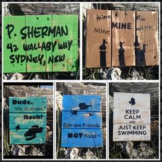 several different signs on the side of a wooden fence that have been vandalized