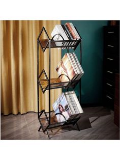 three tiered magazine rack with magazines on it