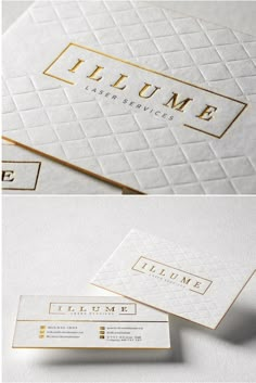 some white and gold business cards on top of each other with the name's logo