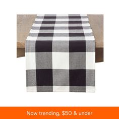 a black and white checkered table runner with the words $ 50 & under on it