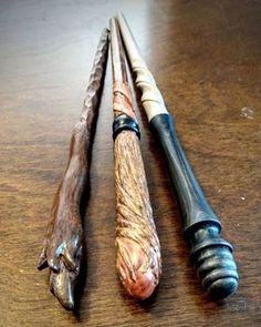 three different types of wood carving tools on a table