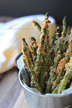 asparagus with parmesan cheese and seasoning in a tin