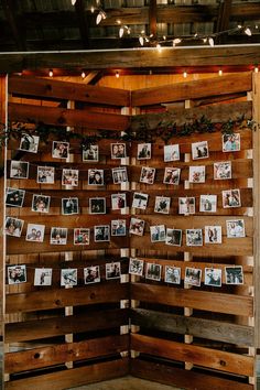 a wooden wall with pictures on it and lights strung from the ceiling above them, along with string lights