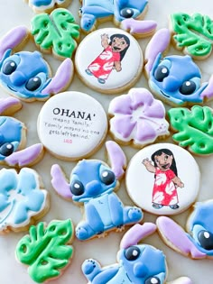 cookies decorated with cartoon characters and words on them are arranged in the shape of an elephant