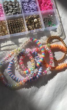 beads and bracelets are arranged in plastic containers