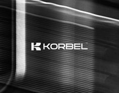 the korbel logo is shown on a black and white background with wavy lines