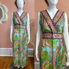 "Vibrant 70s handmade maxi dress. Dress has a colorful paisley/abstract print made up of pinks, blues and greens. The front is a criss cross top that cinches at the waist. Zips in back. Condition: Excellent/good - some light faded spots in dress but they do not detract from this beautiful dress! Measurements (approx.+ laid flat): Shoulder to shoulder:15.5\" Pit to pit:18\" Waist:16\" Hips:23\" Total length:54\" Follow us on IG for more shop updates @modern_m_vintage Check out our other listings: Pastel Maxi Dresses, Turquoise Maxi Dress, Empire Waist Maxi Dress, Dress Empire Waist, Criss Cross Top, Cross Top, Syracuse Ny, Dress Flowy, Tent Dress