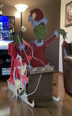 the grinch costume is on display in this living room