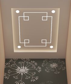 an empty room with a square light above the floor and flower designs on the wall