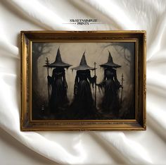 three witches standing in front of a white sheet with the words halloween prints on it