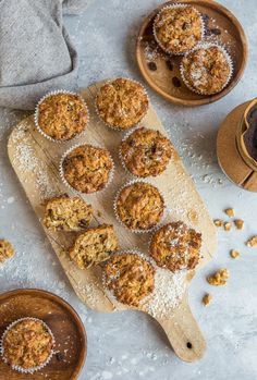 muffins on a cutting board with other food items