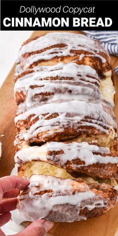 cinnamon bread with icing on a cutting board