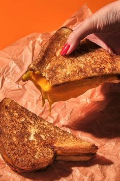 Girl Holding Browned Grilled Cheese Dripping Cheese on orange background Grilled Cheese Photography Food Styling, Grilled Cheese Photography, Cheese Photography Food Styling, Fast Food Photoshoot, Fast Food Photography, Cafe Food Photography, Sandwich Station, Creative Food Photography, Yummy Lunch Recipes