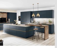 a modern kitchen with blue cabinets and wooden flooring is pictured in this image, there are two stools at the center of the island