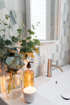 As a Style Curator bathroom makeover, this bathroom has stolen our hearts with ming green paddlepop tiles and gorgeous finishings. The green tonal fish tail tiles with this white shaker vanity, white basin, brushed nickel taps and white square mirror all play a part in this gorgeous bathroom. Click on the pin or go to StyleCurator.com.au to find more. Cream Bathroom Accessories, Light Green Bathroom Aesthetic, Bathroom With Green Accessories, Green And White Marble Bathroom, Ming Green Marble Bathroom, White And Silver Bathroom Ideas, Sage Green Bathroom Accessories, White Bathroom Styling, Bathroom Green Decor