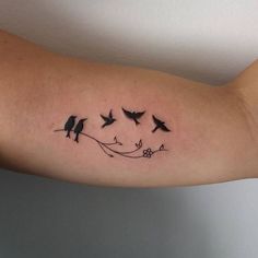 a woman's arm with birds on it