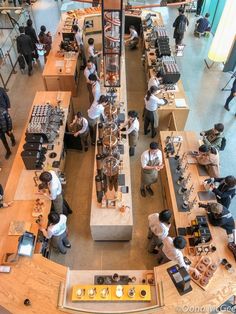 an overhead view of people shopping in a store with lots of counter space and counters