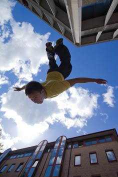 a young man flying through the air while riding a skateboard