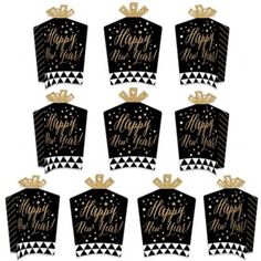 black and gold new year's evet party decorations with crowns on each one