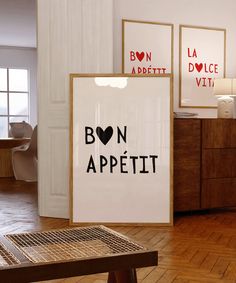 there is a sign that says bon appetit in black and white on the wall