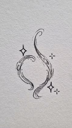 the letter s is drawn in black ink on white paper with stars and swirls