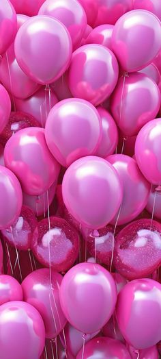 many pink balloons floating in the air with white pins sticking out of it's center