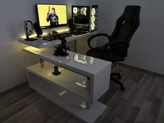 a computer desk with two monitors and a chair in front of it on top of a hard wood floor