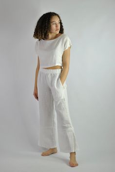 "This is our no. 58 of Conscious Clothing Concept. This super comfy linen is very versatile to wear not only in bed or around the house but you can wear it out with summer accessories. The trousers are lose and comfy fit with elasticated waist and two pockets. The top is modern, loose fitting and short. This set is made of high quality pure white linen. It is the ultimate fabric for hot weather as it breathes and absorbs moisture better that any fabric on earth. But in the winter keeps us warm a Casual Linen Sets With Pockets, White Linen Lounging Bottoms, Relaxed Fit Sets For Summer Relaxation, White Linen Bottoms For Relaxation, White Linen Summer Sets, White Linen Casual Sets, Casual Linen Beachwear Set, Casual Linen Beach Set, Casual Linen Sets For Vacation