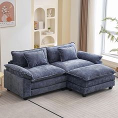 a living room with a blue sectional couch