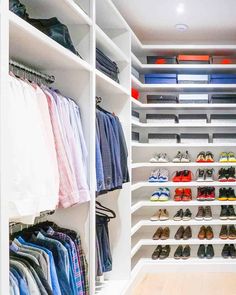 an organized closet with white shelving and lots of shoes