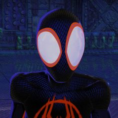 a spider - man with glowing eyes and an orange web orb in front of him