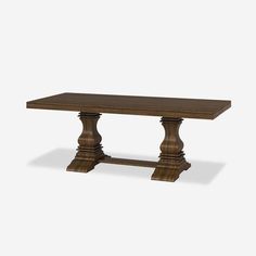 a wooden table with two pedestals on the top and one leg raised to the side