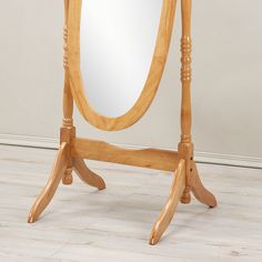 a wooden stand with a large mirror on it's top and one leg in the middle