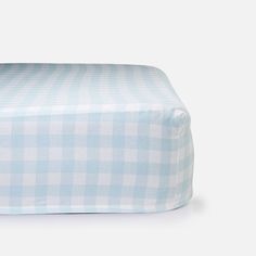 a blue and white checkered bed sheet