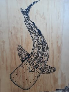 a drawing of a bird flying in the air with an intricate pattern on it's wings