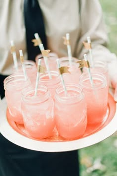 two pictures with drinks and straws in them on the same plate, one is pink