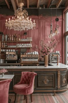 an old fashioned bar with pink chairs and chandelier hanging from the ceiling in a restaurant