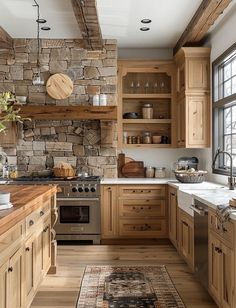 a kitchen with wooden cabinets and stone walls