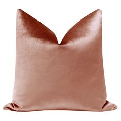 a pink pillow with a satin finish on the front and back of it's cushion