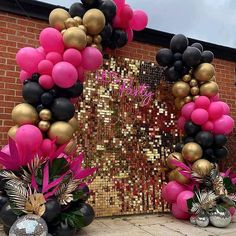 balloons and streamers decorate the entrance to a party