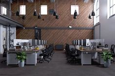 an empty office with several desks and chairs